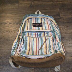 JanSport backpack with striped pattern, suitable for hiking and school.
